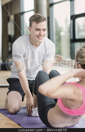 To use this stock image in your creative project, please select the size you need over to the right and click the "Add to Cart" button.
Your downloaded image will come with the Cutcaster watermark removed so don’t worry about the watermark you see on this page. smiling woman with male trainer exercising in gym stock photo, sport, fitness, lifestyle and people concept - smiling woman with male personal trainer exercising in gym by Syda Productions