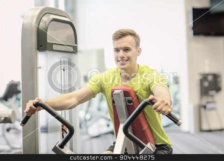 To use this stock image in your creative project, please select the size you need over to the right and click the "Add to Cart" button.
Your downloaded image will come with the Cutcaster watermark removed so don’t worry about the watermark you see on this page. smiling man exercising in gym stock photo, sport, fitness, lifestyle and people concept - smiling man exercising in gym by Syda Productions