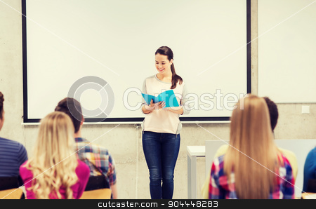 To use this stock image in your creative project, please select the size you need over to the right and click the "Add to Cart" button.
Your downloaded image will come with the Cutcaster watermark removed so don’t worry about the watermark you see on this page. group of smiling students in classroom stock photo, education, high school, teamwork and people concept - smiling student girl with notebook standing in front of students in classroom by Syda Productions