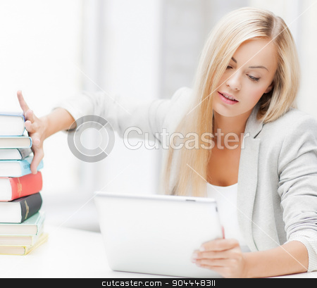 To use this stock image in your creative project, please select the size you need over to the right and click the "Add to Cart" button.
Your downloaded image will come with the Cutcaster watermark removed so don’t worry about the watermark you see on this page. student with books and tablet pc stock photo, student with tablet pc pushing away stack of books by Syda Productions