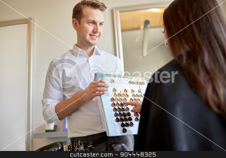 To use this stock image in your creative project, please select the size you need over to the right and click the "Add to Cart" button.
Your downloaded image will come with the Cutcaster watermark removed so don’t worry about the watermark you see on this page. woman choosing hair color from palette at salon stock photo, beauty, hair dyeing and people concept - happy young woman with hairdresser choosing hair color from palette samples at salon by Syda Productions