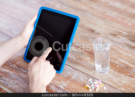To use this stock image in your creative project, please select the size you need over to the right and click the "Add to Cart" button.
Your downloaded image will come with the Cutcaster watermark removed so don’t worry about the watermark you see on this page. close up of hands with tablet pc, pills and water stock photo, medicine, technology, nutritional supplements and people concept - close up of male hands pointing finger to blank tablet pc computer screen, pills and water on table by Syda Productions