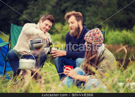 To use this stock image in your creative project, please select the size you need over to the right and click the "Add to Cart" button.
Your downloaded image will come with the Cutcaster watermark removed so don’t worry about the watermark you see on this page. group of smiling friends cooking food outdoors stock photo, adventure, travel, tourism and people concept - group of smiling friends cooking food in dixie sitting around bonfire outdoors by Syda Productions