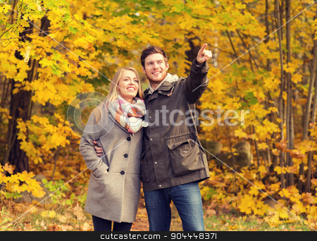 To use this stock image in your creative project, please select the size you need over to the right and click the "Add to Cart" button.
Your downloaded image will come with the Cutcaster watermark removed so don’t worry about the watermark you see on this page. smiling couple hugging in autumn park stock photo, love, relationship, family and people concept - smiling couple hugging and pointing finger in autumn park by Syda Productions