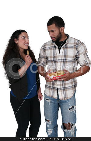 To use this stock image in your creative project, please select the size you need over to the right and click the "Add to Cart" button.
Your downloaded image will come with the Cutcaster watermark removed so don’t worry about the watermark you see on this page. Stealing french fries stock photo, Wife or girlfriend stealing french fries from her boyfriend or husband by Robert Byron