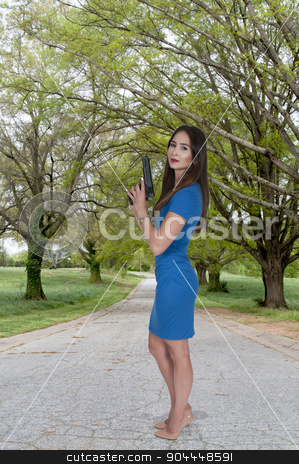 To use this stock image in your creative project, please select the size you need over to the right and click the "Add to Cart" button.
Your downloaded image will come with the Cutcaster watermark removed so don’t worry about the watermark you see on this page. Woman with Pistol stock photo, Beautiful young woman holding a loaded handgun by Robert Byron