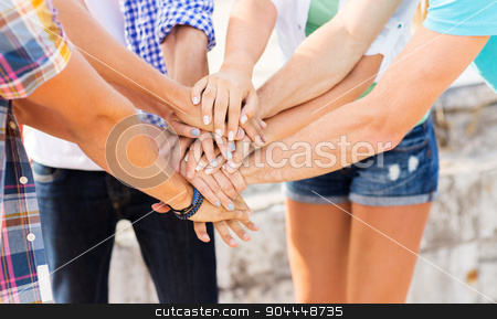 To use this stock image in your creative project, please select the size you need over to the right and click the "Add to Cart" button.
Your downloaded image will come with the Cutcaster watermark removed so don’t worry about the watermark you see on this page. close up of friends hands on top stock photo, success, people, teamwork and gesture concept - cclose up of friends hands on top of each other outdoors by Syda Productions