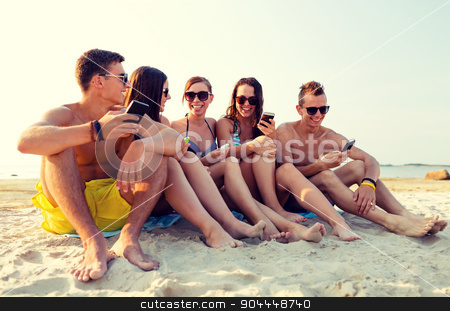 To use this stock image in your creative project, please select the size you need over to the right and click the "Add to Cart" button.
Your downloaded image will come with the Cutcaster watermark removed so don’t worry about the watermark you see on this page. friends with smartphones on beach stock photo, friendship, leisure, summer, technology and people concept - friends with smartphones sitting on sandy beach by Syda Productions