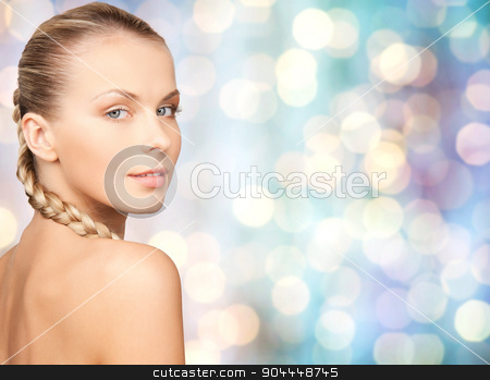 To use this stock image in your creative project, please select the size you need over to the right and click the "Add to Cart" button.
Your downloaded image will come with the Cutcaster watermark removed so don’t worry about the watermark you see on this page. beautiful young woman touching her face stock photo, beauty, people and body care concept - beautiful young woman with bare shoulders over blue holidays lights background by Syda Productions