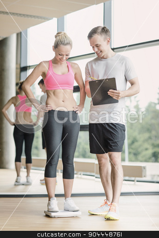 To use this stock image in your creative project, please select the size you need over to the right and click the "Add to Cart" button.
Your downloaded image will come with the Cutcaster watermark removed so don’t worry about the watermark you see on this page. smiling man and woman with scales in gym stock photo, sport, fitness, lifestyle and people concept - smiling man and woman with scales and clipboard in gym by Syda Productions