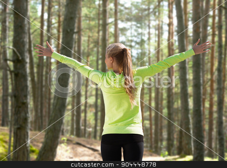 To use this stock image in your creative project, please select the size you need over to the right and click the "Add to Cart" button.
Your downloaded image will come with the Cutcaster watermark removed so don’t worry about the watermark you see on this page. happy woman in sport clothes raising hands stock photo, fitness, sport, happiness and people concept - happy woman raising hands over woods background from back by Syda Productions