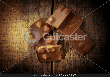 To use this stock image in your creative project, please select the size you need over to the right and click the "Add to Cart" button.
Your downloaded image will come with the Cutcaster watermark removed so don’t worry about the watermark you see on this page. Chocolate on a wooden table stock photo, Chocolate pieces on a wooden table by Roland Valentin Raicu
