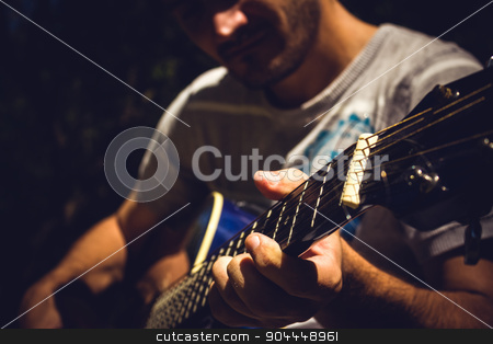 To use this stock image in your creative project, please select the size you need over to the right and click the "Add to Cart" button.
Your downloaded image will come with the Cutcaster watermark removed so don’t worry about the watermark you see on this page. Guitar Player stock photo, Guitar player singing in a park sitting on a tree by Roland Valentin Raicu