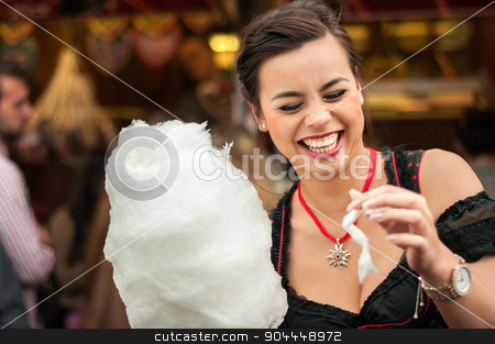 To use this stock image in your creative project, please select the size you need over to the right and click the "Add to Cart" button.
Your downloaded image will come with the Cutcaster watermark removed so don’t worry about the watermark you see on this page. Attractive young woman wearing a traditional Dirndl dress with cotton candy floss at the Oktoberfest. stock photo, Beautiful young smiling woman wearing a traditional Dirndl dress with cotton candy floss at the Oktoberfest. by uleiber