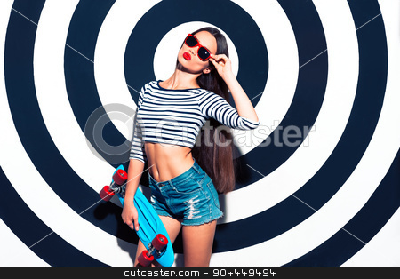 To use this stock image in your creative project, please select the size you need over to the right and click the "Add to Cart" button.
Your downloaded image will come with the Cutcaster watermark removed so don’t worry about the watermark you see on this page. Creative concept of beautiful sexy girl stock photo, Colorful picture of beautiful slim young woman with long hair on black and white background. Girl with sunglasses looking at camera and holding skateboard by Dmytro Sidelnikov