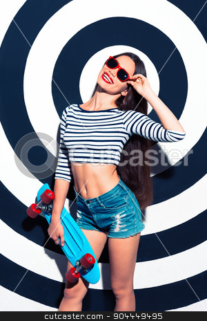 To use this stock image in your creative project, please select the size you need over to the right and click the "Add to Cart" button.
Your downloaded image will come with the Cutcaster watermark removed so don’t worry about the watermark you see on this page. Creative concept of beautiful sexy girl stock photo, Colorful picture of beautiful slim young woman with long hair on black and white background. Girl with sunglasses looking at camera, cheerfully smiling and holding skateboard by Dmytro Sidelnikov