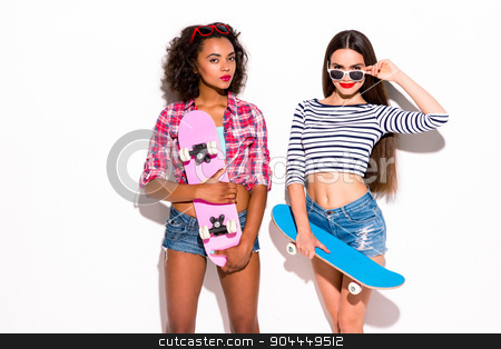 To use this stock image in your creative project, please select the size you need over to the right and click the "Add to Cart" button.
Your downloaded image will come with the Cutcaster watermark removed so don’t worry about the watermark you see on this page. Funky couple. Creative concept of beautiful sexy girls. stock photo, Colorful picture of beautiful slim young women on white background. Girls smiling and holding skateboards by Dmytro Sidelnikov