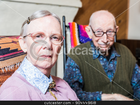 To use this stock image in your creative project, please select the size you need over to the right and click the "Add to Cart" button.
Your downloaded image will come with the Cutcaster watermark removed so don’t worry about the watermark you see on this page. Old Woman and Man Sitting in Livingroom stock photo, Old woman and man looking at camera skeptically by Scott Griessel