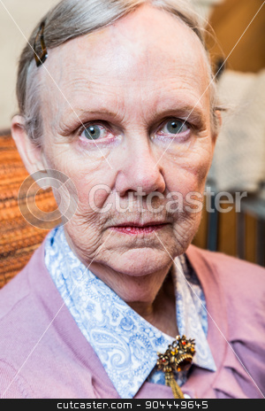 To use this stock image in your creative project, please select the size you need over to the right and click the "Add to Cart" button.
Your downloaded image will come with the Cutcaster watermark removed so don’t worry about the watermark you see on this page. Serious Old Lady stock photo, Serious old lady looks harshly at camera by Scott Griessel