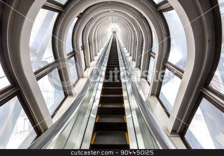 To use this stock image in your creative project, please select the size you need over to the right and click the "Add to Cart" button.
Your downloaded image will come with the Cutcaster watermark removed so don’t worry about the watermark you see on this page. escalators successful concept stock photo, perspective escalators stairway inside contemporary blue glass business centre, concept of successful career elevation by Vichaya Kiatying-Angsulee