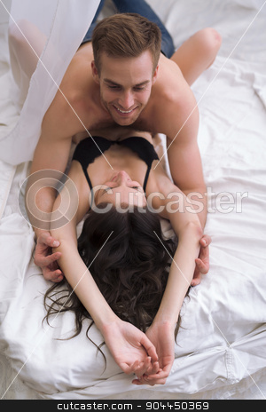 To use this stock image in your creative project, please select the size you need over to the right and click the "Add to Cart" button.
Your downloaded image will come with the Cutcaster watermark removed so don’t worry about the watermark you see on this page. Young lovers lie in bed stock photo, Young lovers lie in bed. The guy is on top by bezikus