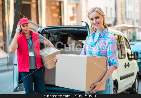 To use this stock image in your creative project, please select the size you need over to the right and click the "Add to Cart" button.
Your downloaded image will come with the Cutcaster watermark removed so don’t worry about the watermark you see on this page. First class delivery service. Courier Delivering Package By Van. stock photo, Colorful picture of courier delivers package for woman. Woman is receiving the parcel and smiling. by Dmytro Sidelnikov