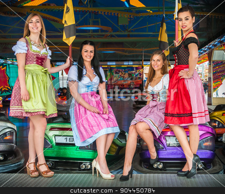 To use this stock image in your creative project, please select the size you need over to the right and click the "Add to Cart" button.
Your downloaded image will come with the Cutcaster watermark removed so don’t worry about the watermark you see on this page. Young and attractive women at Oktoberfest with traditional dirndl dresses, autoscooter in the background stock photo, Joyful and attractive women at Oktoberfest with traditional dirndl dresses, autoscooter in the background. Mixed nationalities, German, Asian, Slavic by uleiber