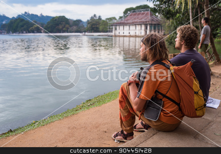 To use this stock image in your creative project, please select the size you need over to the right and click the "Add to Cart" button.
Your downloaded image will come with the Cutcaster watermark removed so don’t worry about the watermark you see on this page. Young Man Traveler with backpack reading book stock photo, Young Man Traveler with backpack reading book and writing notes outdoor mountains on background Summer vacations and Lifestyle concept by Vassiliy Kochetkov