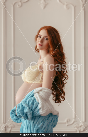 To use this stock image in your creative project, please select the size you need over to the right and click the "Add to Cart" button.
Your downloaded image will come with the Cutcaster watermark removed so don’t worry about the watermark you see on this page. Pregnant woman with hands over tummy stock photo, Portrait of a pretty young woman holding pregnant belly in underwear by Dmytro Buianskyi