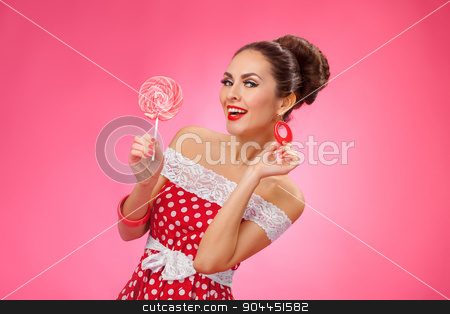 To use this stock image in your creative project, please select the size you need over to the right and click the "Add to Cart" button.
Your downloaded image will come with the Cutcaster watermark removed so don’t worry about the watermark you see on this page. Happy Woman Holding red Lollipop. Pin-up retro style. stock photo, Funny portrait of cute young female model with candy in her arms wearing red dress by Dmytro Buianskyi