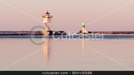 To use this stock image in your creative project, please select the size you need over to the right and click the "Add to Cart" button.
Your downloaded image will come with the Cutcaster watermark removed so don’t worry about the watermark you see on this page. Morning Light Harbor Breakwater Lighthouse Lake Superior Minnesota stock photo, The water is still frozen here in April on Lake Superior by Christopher Boswell