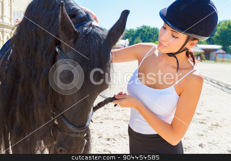 To use this stock image in your creative project, please select the size you need over to the right and click the "Add to Cart" button.
Your downloaded image will come with the Cutcaster watermark removed so don’t worry about the watermark you see on this page. Beautiful horsewoman with a horse stock photo, Portrait of a beautiful horsewoman wearing an equestrian helmet and a white top standing near a big brown horse, looking at the animal by Zinkevych