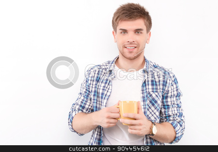 To use this stock image in your creative project, please select the size you need over to the right and click the "Add to Cart" button.
Your downloaded image will come with the Cutcaster watermark removed so don’t worry about the watermark you see on this page. Handsome man isolated on white stock photo, Portrait of a handsome young man standing looking at the camera smiling and holding a yellow cup of coffee in his hands, wearing white t-short and blue checkered shirt, isolated in white background by Zinkevych