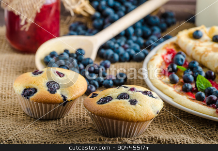 To use this stock image in your creative project, please select the size you need over to the right and click the "Add to Cart" button.
Your downloaded image will come with the Cutcaster watermark removed so don’t worry about the watermark you see on this page. Blueberry muffins and pancakes stock photo, Blueberry muffins and pancakes, milk and jam in background and basket full of blueberries by Peteer