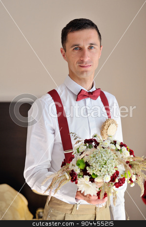 To use this stock image in your creative project, please select the size you need over to the right and click the "Add to Cart" button.
Your downloaded image will come with the Cutcaster watermark removed so don’t worry about the watermark you see on this page. portrait of the groom with a bouquet in hands stock photo, portrait of the groom with a bouquet in hands. by timonko
