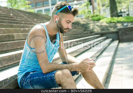 To use this stock image in your creative project, please select the size you need over to the right and click the "Add to Cart" button.
Your downloaded image will come with the Cutcaster watermark removed so don’t worry about the watermark you see on this page. Man listening to the music with earbuds from a smart phone stock photo, A Man listening to the music with earbuds from a smart phone by Louis-Paul St-Onge
