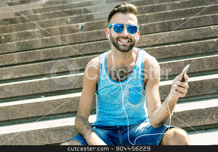 To use this stock image in your creative project, please select the size you need over to the right and click the "Add to Cart" button.
Your downloaded image will come with the Cutcaster watermark removed so don’t worry about the watermark you see on this page. Man listening to the music with earbuds from a smart phone stock photo, A Man listening to the music with earbuds from a smart phone by Louis-Paul St-Onge