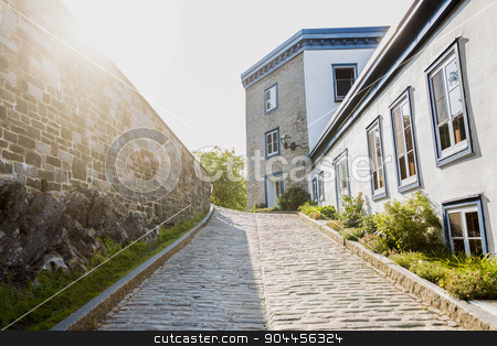 To use this stock image in your creative project, please select the size you need over to the right and click the "Add to Cart" button.
Your downloaded image will come with the Cutcaster watermark removed so don’t worry about the watermark you see on this page. Street of old Quebec stock photo, A Street of old Quebec city with sun on the left side by Louis-Paul St-Onge
