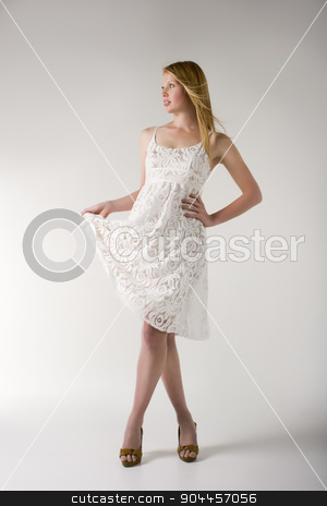 To use this stock image in your creative project, please select the size you need over to the right and click the "Add to Cart" button.
Your downloaded image will come with the Cutcaster watermark removed so don’t worry about the watermark you see on this page. Model in white dress stock photo, Model posing in a white dress and brown open toe heels in a studio by JRstock