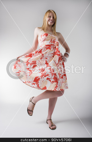 To use this stock image in your creative project, please select the size you need over to the right and click the "Add to Cart" button.
Your downloaded image will come with the Cutcaster watermark removed so don’t worry about the watermark you see on this page. Playful woman in orange print dress stock photo, Playful woman posing in orange and white print dress and sandals by JRstock