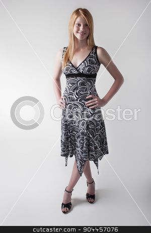 To use this stock image in your creative project, please select the size you need over to the right and click the "Add to Cart" button.
Your downloaded image will come with the Cutcaster watermark removed so don’t worry about the watermark you see on this page. Smiling model in a black and white dress stock photo, Smiling model posing in a black and white dress and black open toe heels in a studio by JRstock