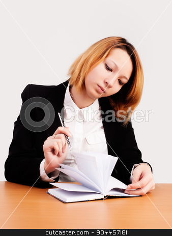 To use this stock image in your creative project, please select the size you need over to the right and click the "Add to Cart" button.
Your downloaded image will come with the Cutcaster watermark removed so don’t worry about the watermark you see on this page. Young red-haired businesswoman stock photo, caucasian businesswoman sitting at desk in casual clothes and working with dayly log by Aikon