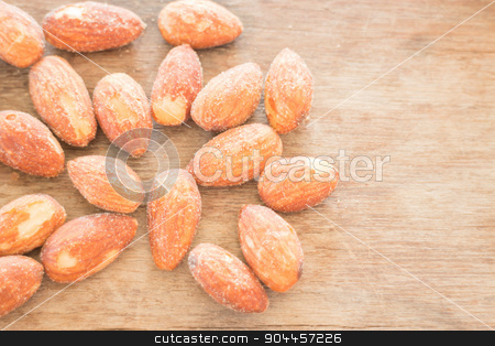 To use this stock image in your creative project, please select the size you need over to the right and click the "Add to Cart" button.
Your downloaded image will come with the Cutcaster watermark removed so don’t worry about the watermark you see on this page. Almond grain roast salt on weathered wooden table stock photo, Almond grain roast salt on weathered wooden table, stock photo by nalinratphi