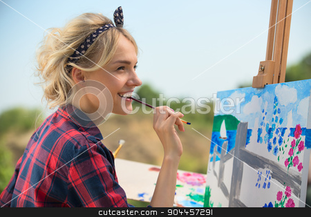 To use this stock image in your creative project, please select the size you need over to the right and click the "Add to Cart" button.
Your downloaded image will come with the Cutcaster watermark removed so don’t worry about the watermark you see on this page. Beautiful blonde woman artist paints a colorful picture. stock photo, Beautiful blonde woman artist in a playful mood dressed in a plaid shirt. She paints a picture with a brush and paints nature by bezikus