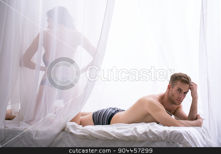To use this stock image in your creative project, please select the size you need over to the right and click the "Add to Cart" button.
Your downloaded image will come with the Cutcaster watermark removed so don’t worry about the watermark you see on this page. Sad morning in the bedroom of a young couple stock photo, Sad morning in the bedroom of a young couple. She undoes her bra back to the camera. Man lying on stomach propped a hand face with a sad emotion. by bezikus