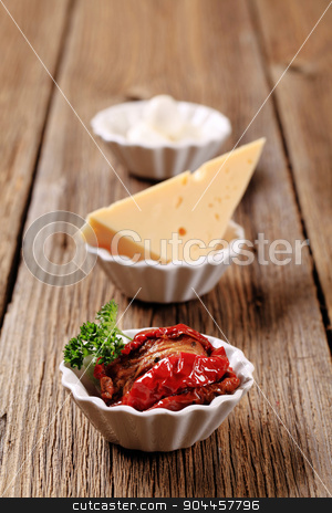 To use this stock image in your creative project, please select the size you need over to the right and click the "Add to Cart" button.
Your downloaded image will come with the Cutcaster watermark removed so don’t worry about the watermark you see on this page. Appetizers stock photo, Sun dried tomatoes and two kinds of cheese by Digifoodstock