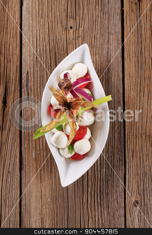 To use this stock image in your creative project, please select the size you need over to the right and click the "Add to Cart" button.
Your downloaded image will come with the Cutcaster watermark removed so don’t worry about the watermark you see on this page. Caprese salad stock photo, Bowl of mozzarella cheese, tomato and basil by Digifoodstock
