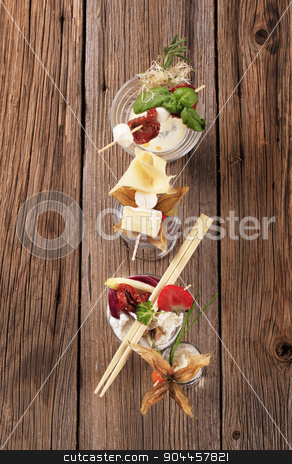 To use this stock image in your creative project, please select the size you need over to the right and click the "Add to Cart" button.
Your downloaded image will come with the Cutcaster watermark removed so don’t worry about the watermark you see on this page. Cheese appetizers stock photo, Cheese appetizers in glass dishes - overhead by Digifoodstock