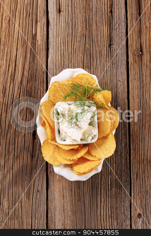 To use this stock image in your creative project, please select the size you need over to the right and click the "Add to Cart" button.
Your downloaded image will come with the Cutcaster watermark removed so don’t worry about the watermark you see on this page. Corn chips and curd cheese stock photo, Bowl of corn chips and curd cheese by Digifoodstock