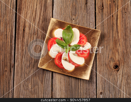 To use this stock image in your creative project, please select the size you need over to the right and click the "Add to Cart" button.
Your downloaded image will come with the Cutcaster watermark removed so don’t worry about the watermark you see on this page. Caprese salad stock photo, Slices of fresh tomato and mozzarella cheese by Digifoodstock
